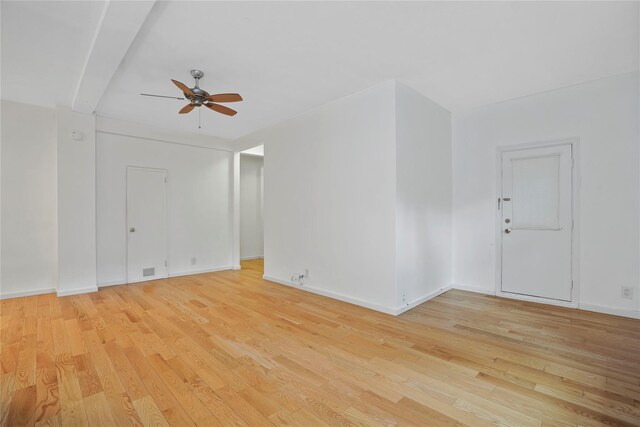 unfurnished room with light wood finished floors, ceiling fan, and baseboards