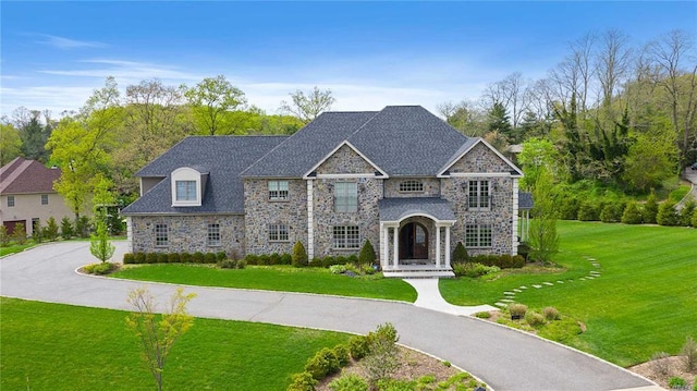 2 Enclave Ct, Dix Hills, NY 11746 - french provincial home featuring stone siding and a front lawn