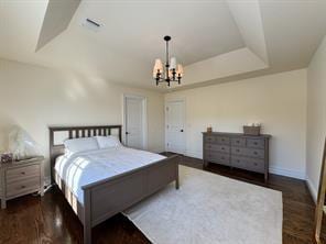 2 Enclave Ct, Dix Hills, NY 11746 - bedroom featuring a chandelier, a tray ceiling, and baseboards