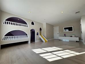 2 Enclave Ct, Dix Hills, NY 11746 - unfurnished living room with baseboards, wood finished floors, and recessed lighting