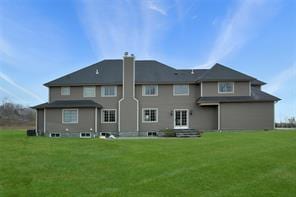 2 Enclave Ct, Dix Hills, NY 11746 - rear view of house with a yard