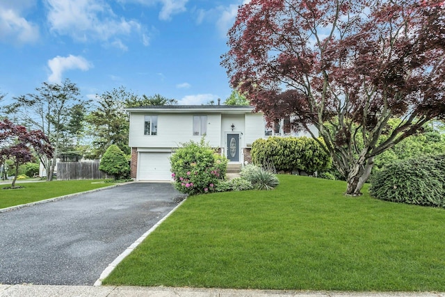 1 Valley Forge Dr, Wheatley Heights, NY 11798 - raised ranch with driveway, an attached garage, and brick siding