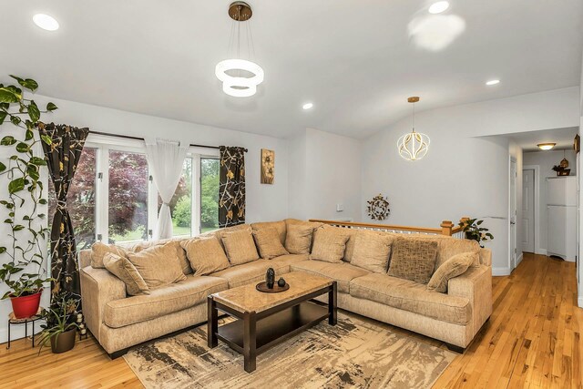1 Valley Forge Dr, Wheatley Heights, NY 11798 - living area featuring light wood-style flooring, recessed lighting, vaulted ceiling, and a chandelier