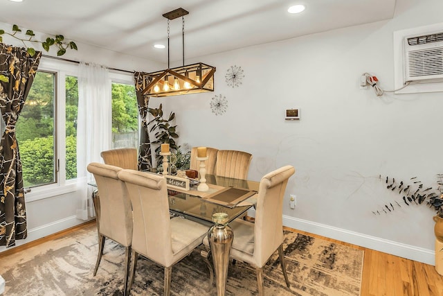 1 Valley Forge Dr, Wheatley Heights, NY 11798 - dining space featuring baseboards, wood finished floors, a wall mounted AC, recessed lighting, and a chandelier