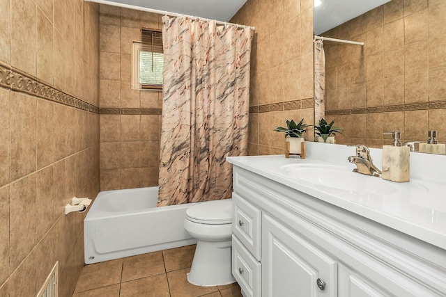 1 Valley Forge Dr, Wheatley Heights, NY 11798 - bathroom with tile walls, toilet, tile patterned floors, vanity, and shower / bath combo