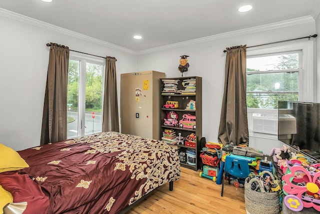 1 Valley Forge Dr, Wheatley Heights, NY 11798 - bedroom featuring wood finished floors, crown molding, access to exterior, and recessed lighting