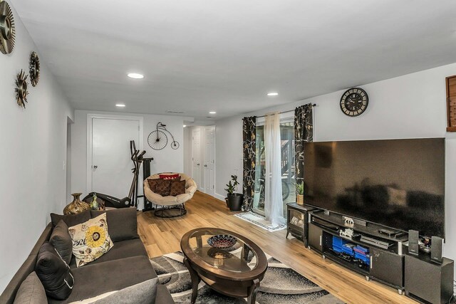 1 Valley Forge Dr, Wheatley Heights, NY 11798 - living area featuring wood finished floors and recessed lighting