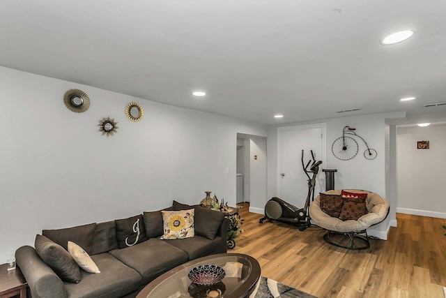 1 Valley Forge Dr, Wheatley Heights, NY 11798 - living room with wood finished floors, recessed lighting, and baseboards