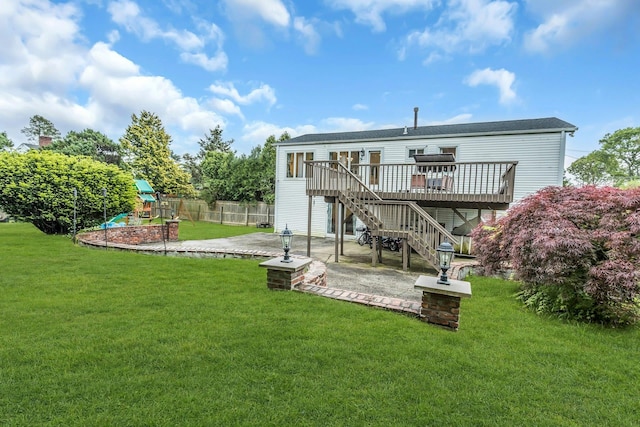 1 Valley Forge Dr, Wheatley Heights, NY 11798 - rear view of house featuring a patio area, a playground, a deck, and stairway