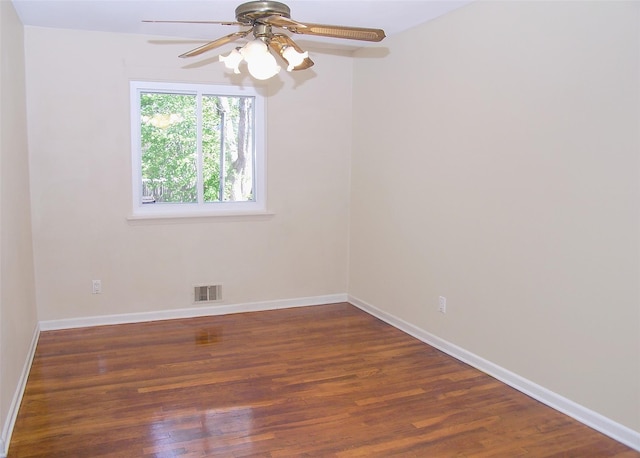 unfurnished room featuring ceiling fan, baseboards, visible vents, and wood finished floors
