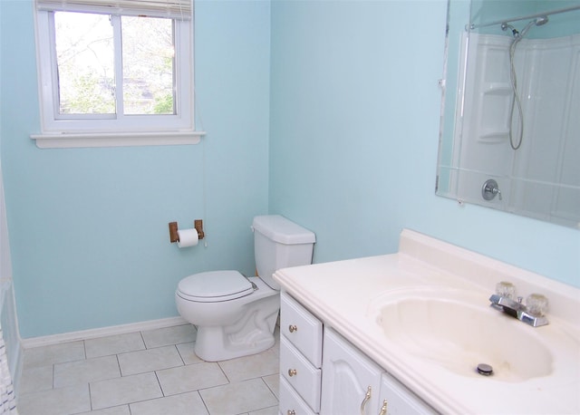 bathroom with walk in shower, vanity, toilet, and tile patterned flooring