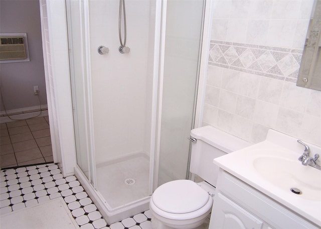 bathroom featuring toilet, tile walls, vanity, a wall unit AC, and a shower stall