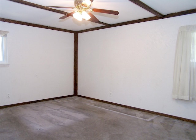 spare room with a ceiling fan, baseboards, and carpet floors