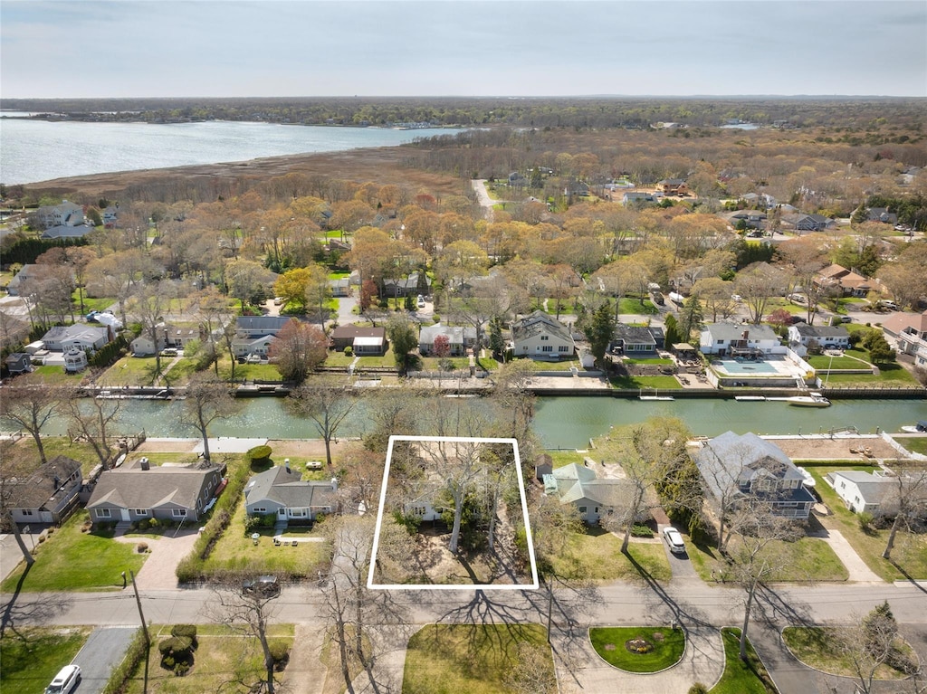 12 Tarpon Rd, East Quogue, NY 11942 - aerial view of residential area featuring property parcel outlined and a nearby body of water