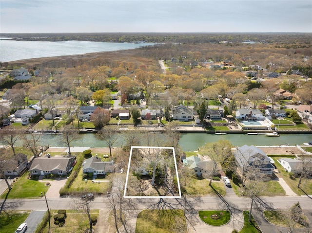 12 Tarpon Rd, East Quogue, NY 11942 - aerial view of residential area featuring property parcel outlined and a nearby body of water
