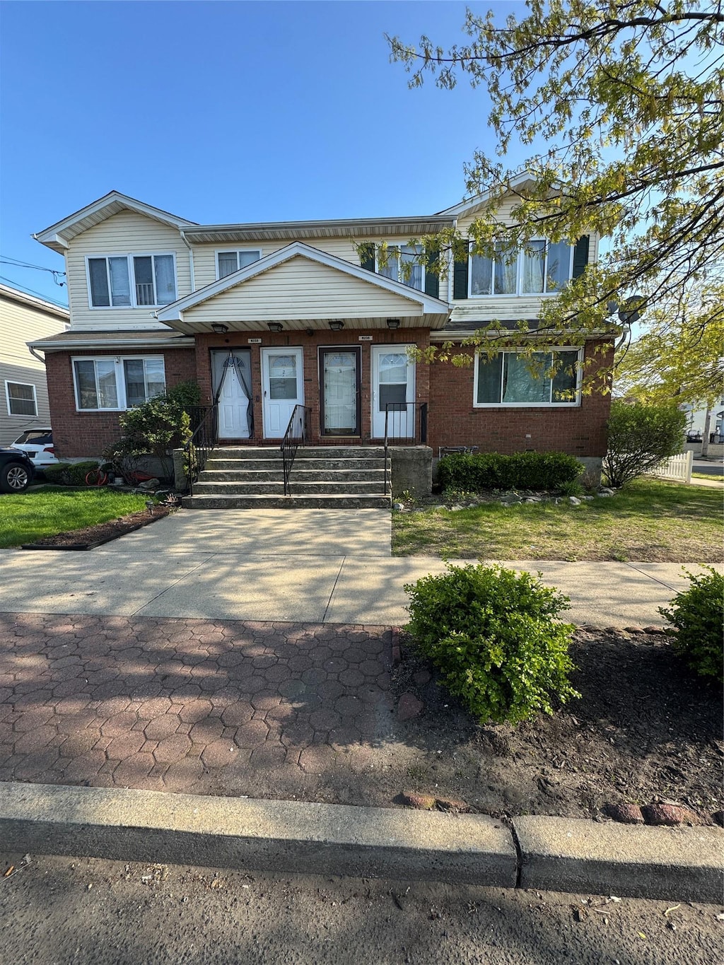 view of front of home featuring brick siding