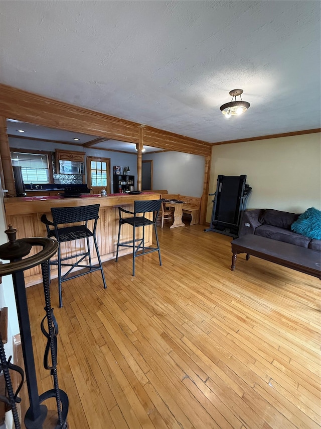 163 E Hawthorne Ave, Valley Stream, NY 11580 - living area with light wood-style floors and a textured ceiling