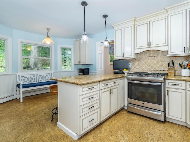 kitchen with a peninsula, light stone counters, pendant lighting, decorative backsplash, and stainless steel gas range