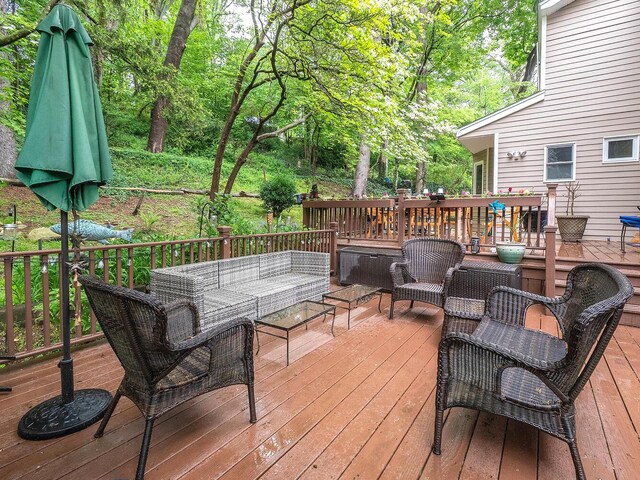 wooden terrace with an outdoor hangout area