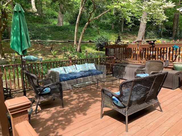 wooden terrace with an outdoor hangout area