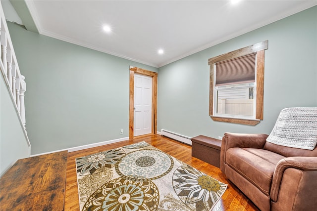 sitting room featuring ornamental molding, wood finished floors, baseboard heating, and recessed lighting