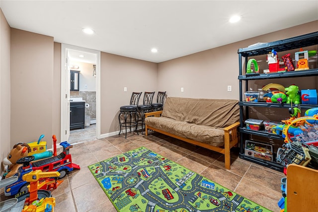 recreation room featuring baseboard heating and recessed lighting