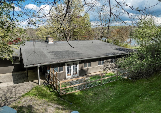 119 W Hunns Lake Rd, Stanfordville, NY 12581 - rear view of house with french doors, roof with shingles, a chimney, and a lawn