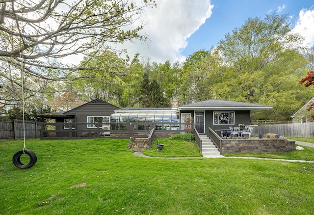 119 W Hunns Lake Rd, Stanfordville, NY 12581 - rear view of house with a deck, a chimney, and a sunroom