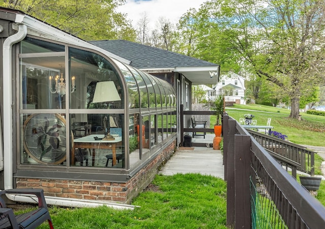 119 W Hunns Lake Rd, Stanfordville, NY 12581 - view of property exterior featuring a sunroom and roof with shingles