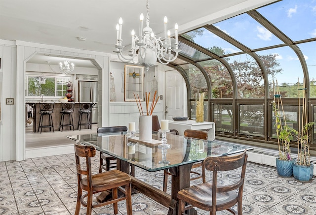 119 W Hunns Lake Rd, Stanfordville, NY 12581 - dining space featuring a chandelier, light tile patterned floors, and arched walkways