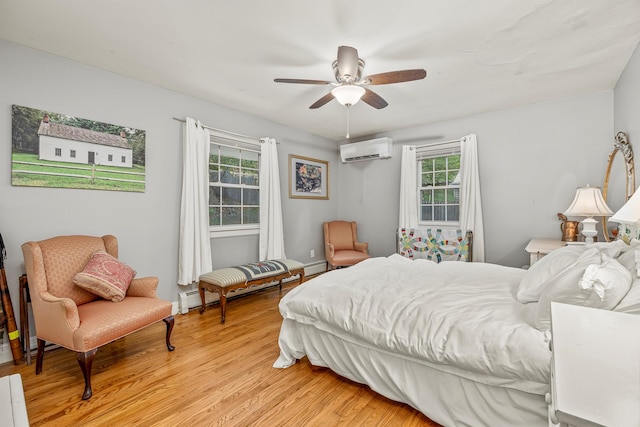 119 W Hunns Lake Rd, Stanfordville, NY 12581 - bedroom with a wall mounted air conditioner, multiple windows, light wood finished floors, and a baseboard radiator