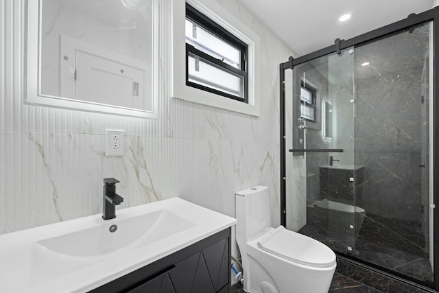 full bath featuring tile walls, toilet, marble finish floor, vanity, and a marble finish shower