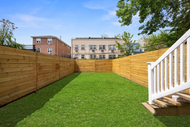 view of yard with a fenced backyard