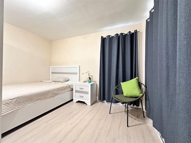 bedroom featuring light wood-type flooring