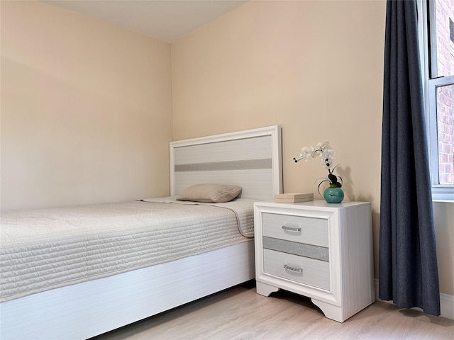 bedroom featuring light wood-type flooring