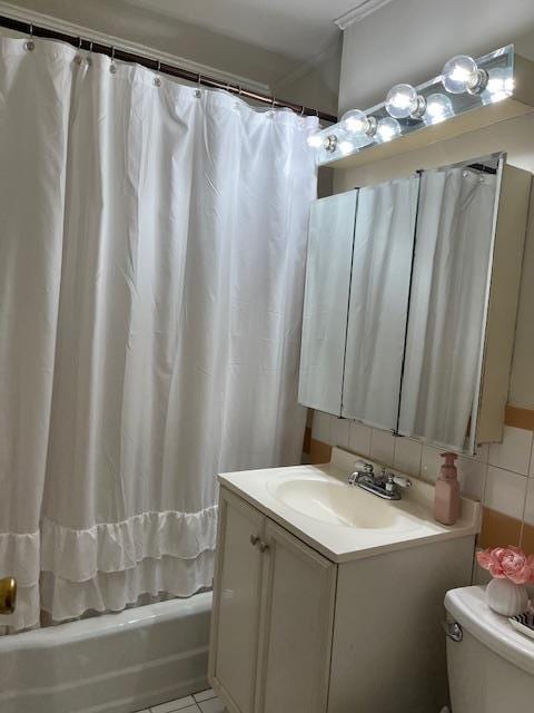 full bath with vanity, shower / tub combo with curtain, toilet, and tile patterned floors