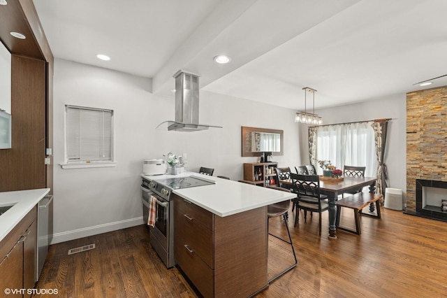 79 Sands Point Rd, Port Washington, NY 11050 - kitchen with island exhaust hood, a peninsula, appliances with stainless steel finishes, and light countertops