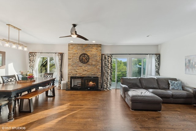 79 Sands Point Rd, Port Washington, NY 11050 - living area with a ceiling fan, a stone fireplace, plenty of natural light, and wood finished floors