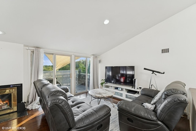 79 Sands Point Rd, Port Washington, NY 11050 - living room featuring visible vents, wood finished floors, lofted ceiling, a glass covered fireplace, and recessed lighting