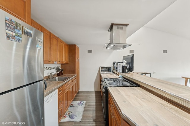 79 Sands Point Rd, Port Washington, NY 11050 - kitchen with freestanding refrigerator, dishwasher, black / electric stove, a sink, and island exhaust hood