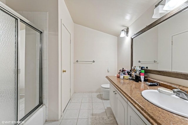79 Sands Point Rd, Port Washington, NY 11050 - bathroom with toilet, tile patterned floors, enclosed tub / shower combo, and vanity