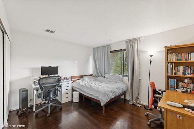 79 Sands Point Rd, Port Washington, NY 11050 - bedroom featuring visible vents, wood finished floors, and a closet