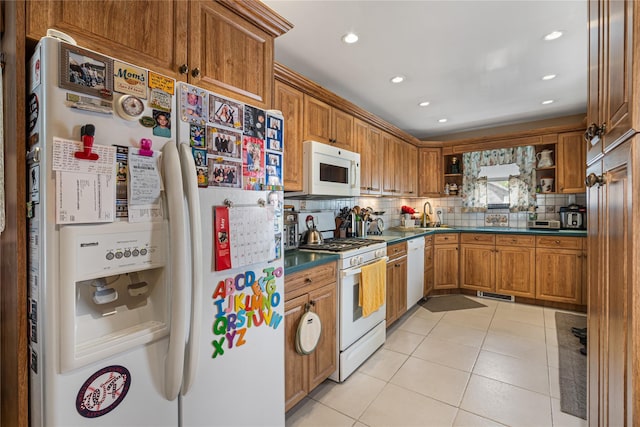 kitchen with white appliances, open shelves, dark countertops, and decorative backsplash