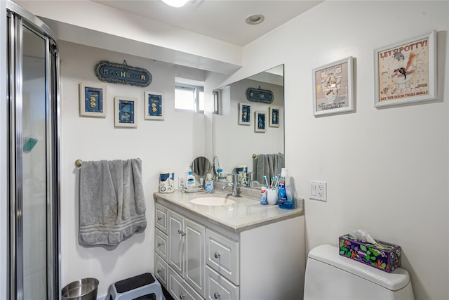full bathroom with vanity, toilet, and an enclosed shower