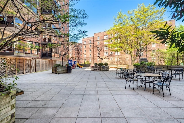 70-20 108th St Unit 15A, Forest Hills, NY 11375 - view of patio / terrace with playground community and fence