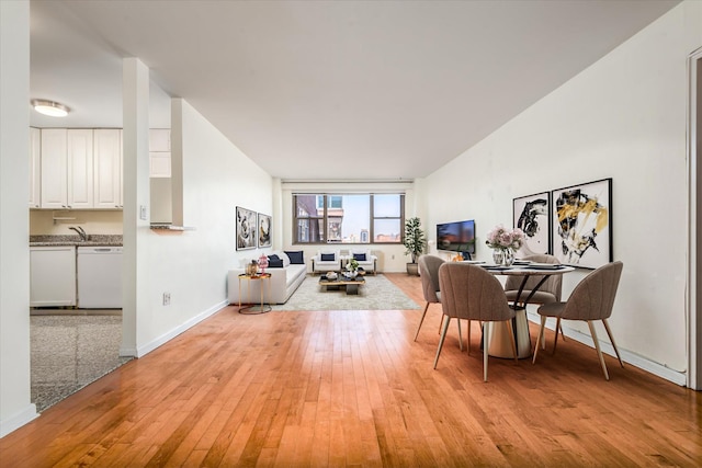 70-20 108th St Unit 15A, Forest Hills, NY 11375 - dining space with baseboards and light wood finished floors