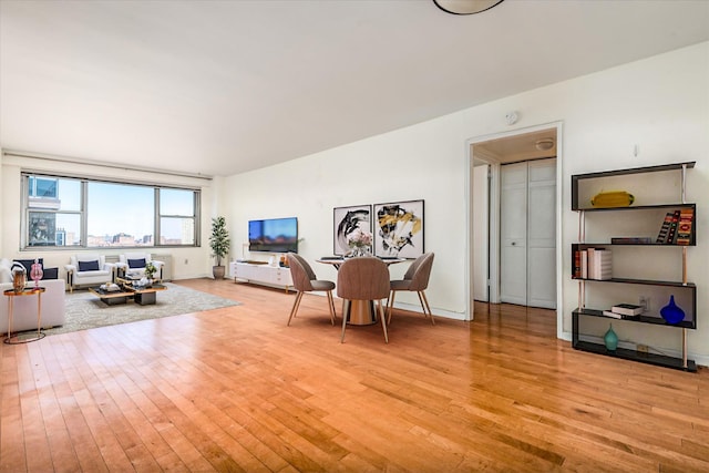 70-20 108th St Unit 15A, Forest Hills, NY 11375 - living area featuring light wood finished floors and baseboards