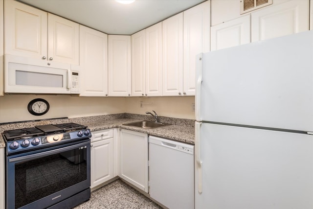 70-20 108th St Unit 15A, Forest Hills, NY 11375 - kitchen featuring a sink, white appliances, visible vents, light countertops, and white cabinets