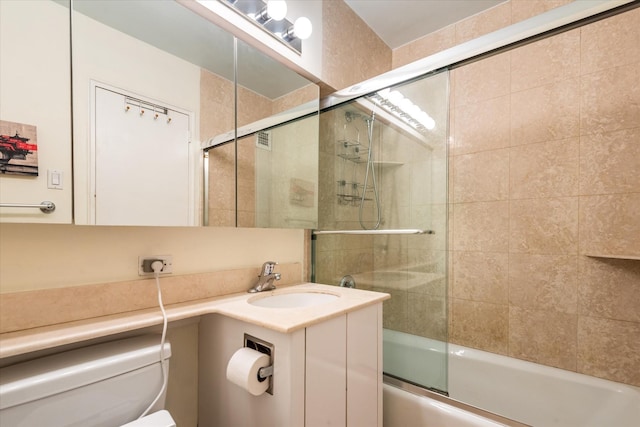 70-20 108th St Unit 15A, Forest Hills, NY 11375 - full bathroom with vanity, toilet, and bath / shower combo with glass door