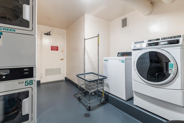 70-20 108th St Unit 15A, Forest Hills, NY 11375 - shared laundry area featuring stacked washer / drying machine, washing machine and dryer, and visible vents